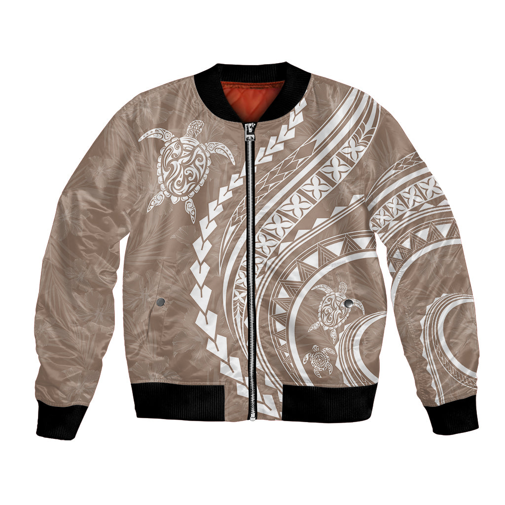 Beige bomber jacket with full-zip front, black ribbed cuffs, white Polynesian turtle print