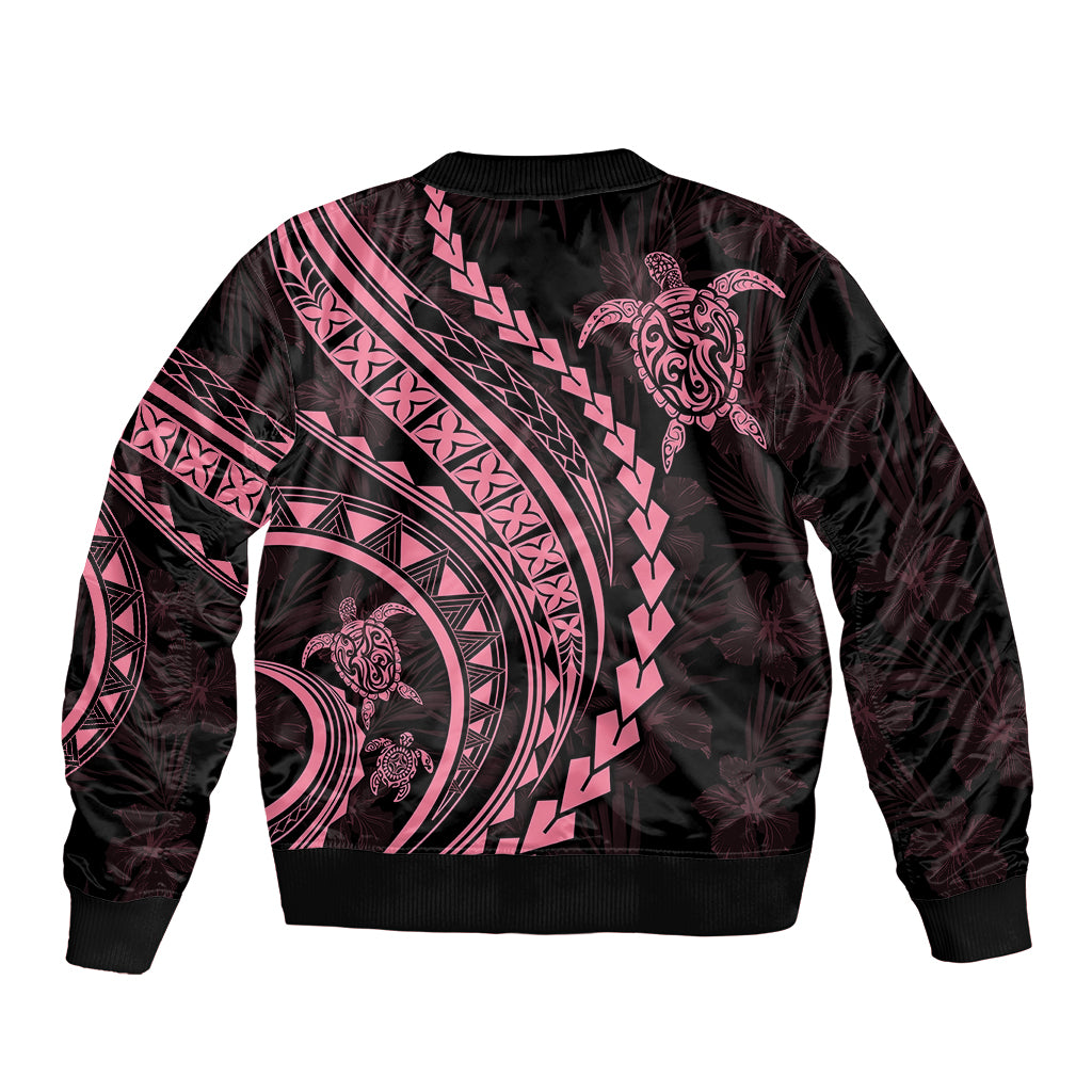 Black unisex bomber jacket back with pink Polynesian tribal patterns and turtle graphic
