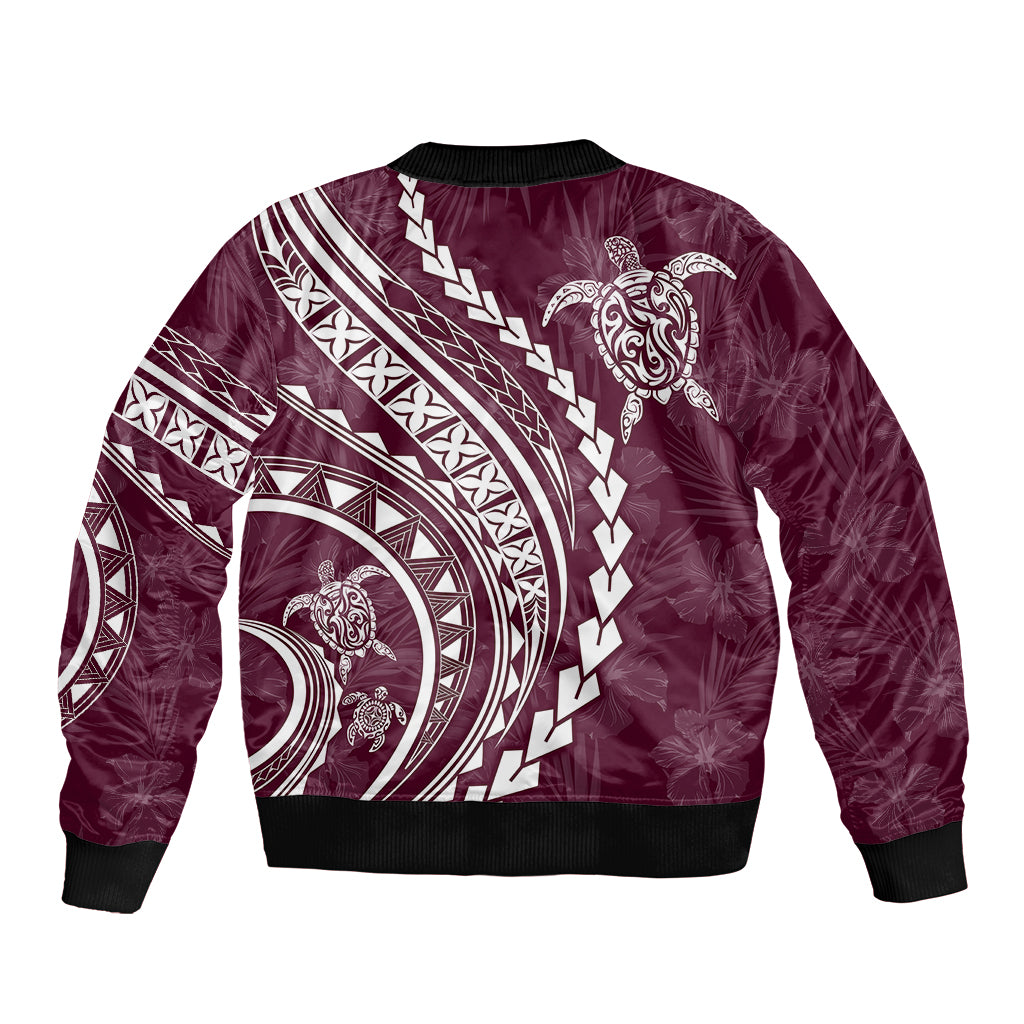 Maroon bomber jacket with ribbed trim and white Polynesian-style tribal print back