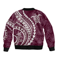 Maroon bomber jacket with ribbed trim and white Polynesian-style tribal print back