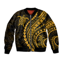 Black bomber jacket with gold tribal turtle print, front zipper and ribbed cuffs