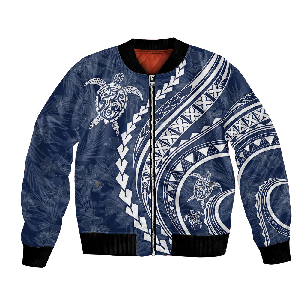 Navy bomber jacket with front zipper, turtle and tribal print, black ribbed cuffs, red lining