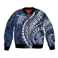Navy bomber jacket with front zipper, turtle and tribal print, black ribbed cuffs, red lining
