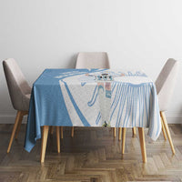 Sky blue tablecloth with football player motif and swirl stripe lines on dining table