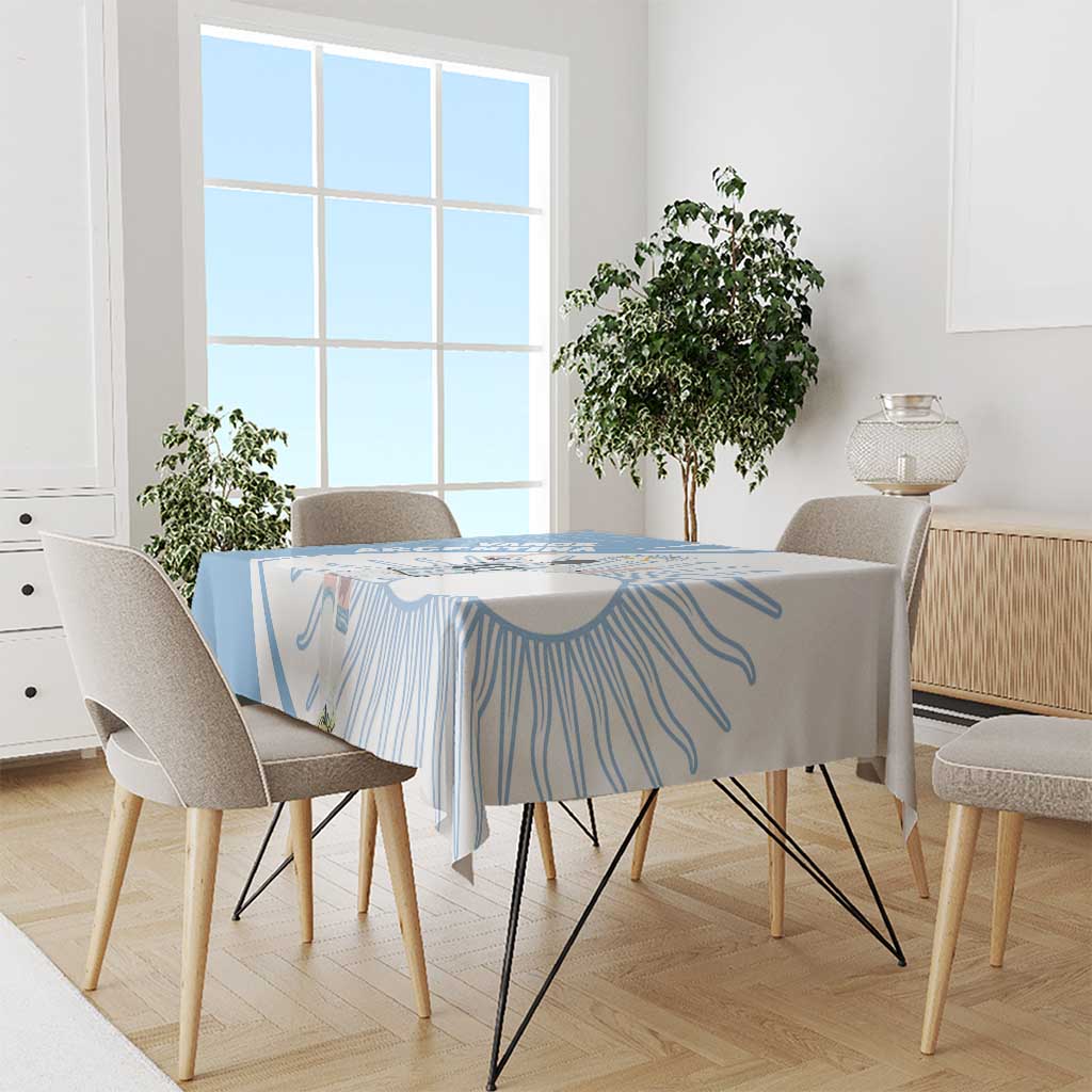 Sky blue tablecloth on dining table with player emblem and swirl line pattern