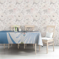 Sky blue tablecloth with player graphic and swirl line design on dining table
