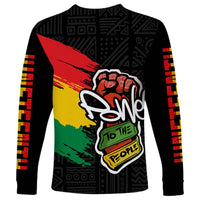 Black unisex long sleeve shirt with large hand graphic in red, yellow, and green