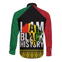 Back of long sleeve button shirt with black yoke and red-green patterned graphic
