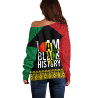 Women’s off-shoulder sweater back, black 'I AM BLACK HISTORY' graphic with red/green pattern