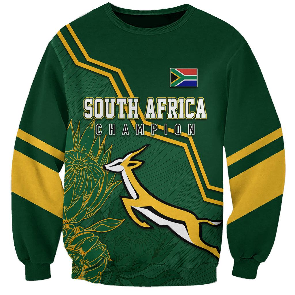 Green sweatshirt with South Africa Champion graphic, flag patch, and gold sleeve stripes