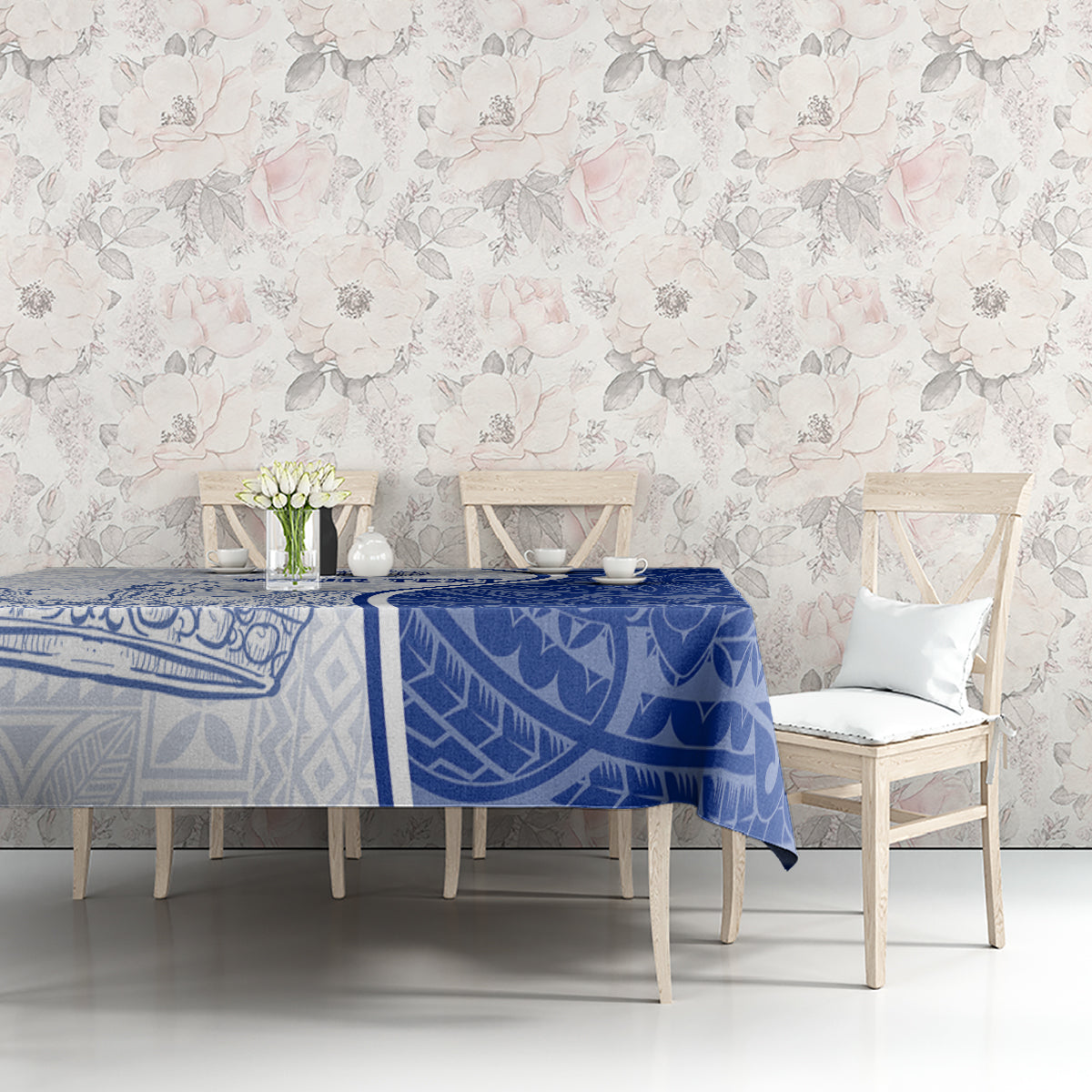Blue and white patterned tablecloth on table with border design