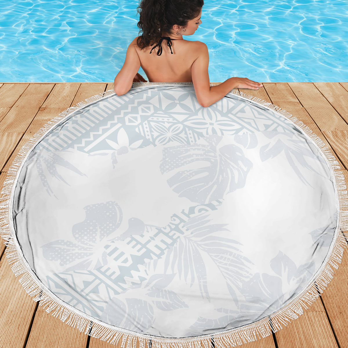Round white beach blanket with gray tropical hibiscus, leaf design, and fringe edge