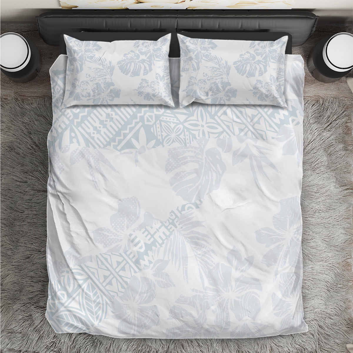 White duvet cover set with light blue leaf/hibiscus pattern and 2 pillowcases