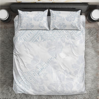 White duvet cover set with light blue leaf/hibiscus pattern and 2 pillowcases