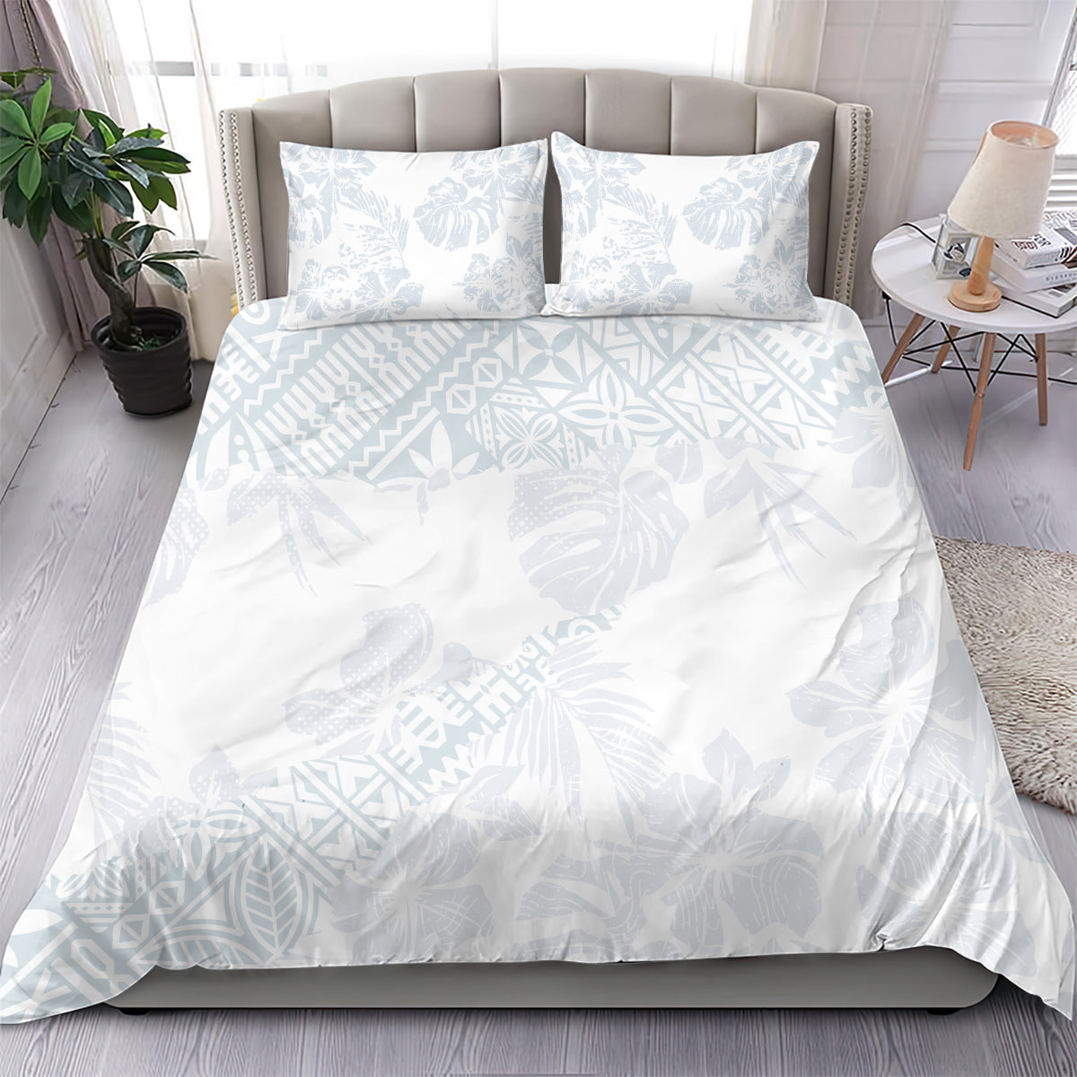 White duvet cover and two pillowcases, light blue hibiscus and leaf pattern