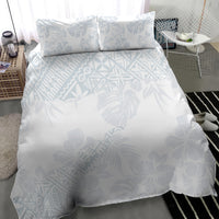 White duvet cover with light blue hibiscus/leaf print and matching 2 pillowcases
