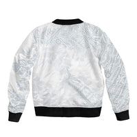 Back view of white bomber jacket with light-blue pattern, ribbed collar, cuffs, hem