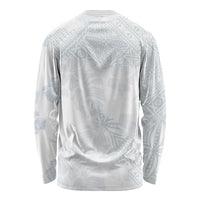 White long-sleeve shirt with light blue all-over leaf and hibiscus print, back view