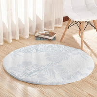 Round light blue rug with hibiscus floral pattern and circular shape