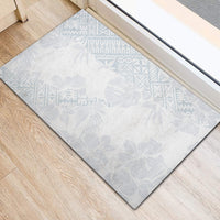 Rectangular light blue patterned rubber doormat with dark edging