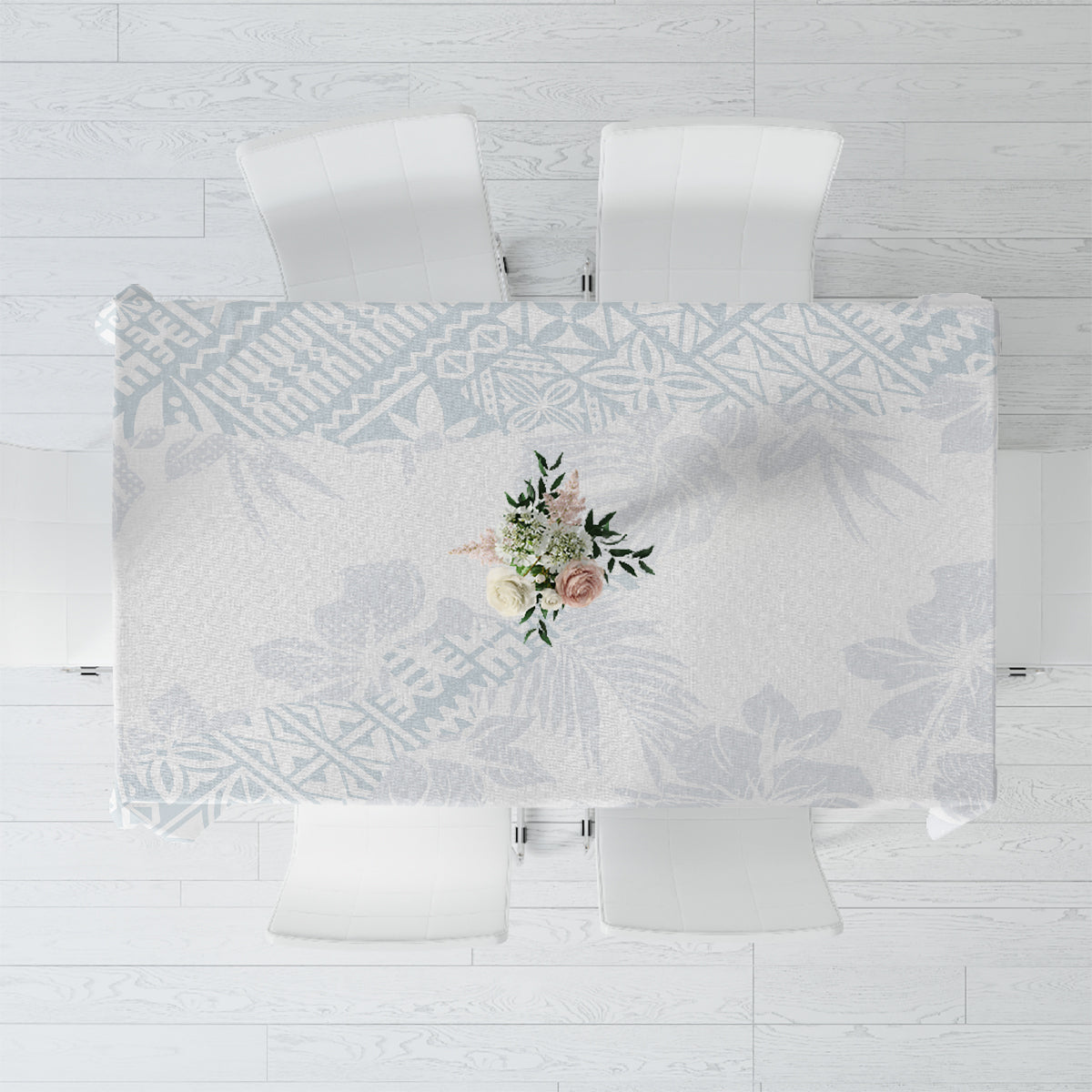 White-and-light-blue floral tablecloth with a centered bouquet motif, rectangular cut.