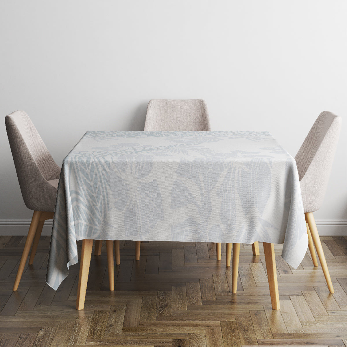 Light-blue floral tablecloth covering a square table with four upholstered chairs.