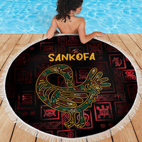 Round beach blanket featuring Sankofa text and bird graphic in red and black, white fringe
