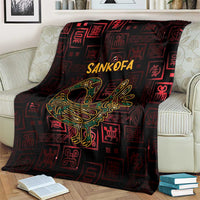 Africa Adinkra symbol blanket on cream sofa, Sankofa bird and Adinkra icons in gold on dark
