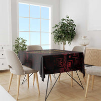Adinkra symbol tablecloth on dining table, black with red and gold Sankofa bird design