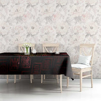 Adinkra symbol tablecloth on dining table, black with red glyphs and gold Sankofa bird