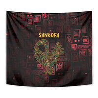 Close view tapestry: Sankofa bird in gold on dark red with patterned Adinkra symbols