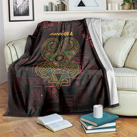 Sankofa heart blanket with dark red and black geometric pattern, gold-green heart and text