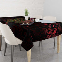 Dark red tablecloth with Sankofa heart Adinkra pattern covering tabletop