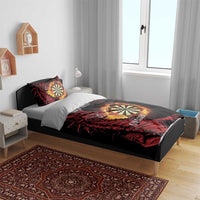 Black duvet set with red dragon and dartboard print, two pillowcases on a bed