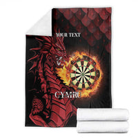 Folded black personalized dragon blanket with dartboard, 'YOUR TEXT', and 'CYMRU'