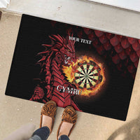 Black rubber doormat with red dragon dartboard art and 'YOUR TEXT' outdoors.