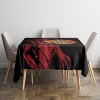 Black tablecloth with red dragon and dart board motif on square dining table