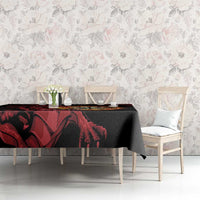 Black tablecloth with red dragon and dart board graphic across dining table