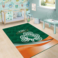 Green area rug for kids room with Celtic shamrock football logo, orange border accents