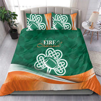 Green duvet with Celtic shamrock rugby emblem and orange wavy band, with two pillows