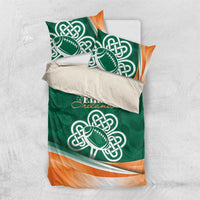 Green bedding set with Celtic shamrock rugby logo, paired pillows, orange hem