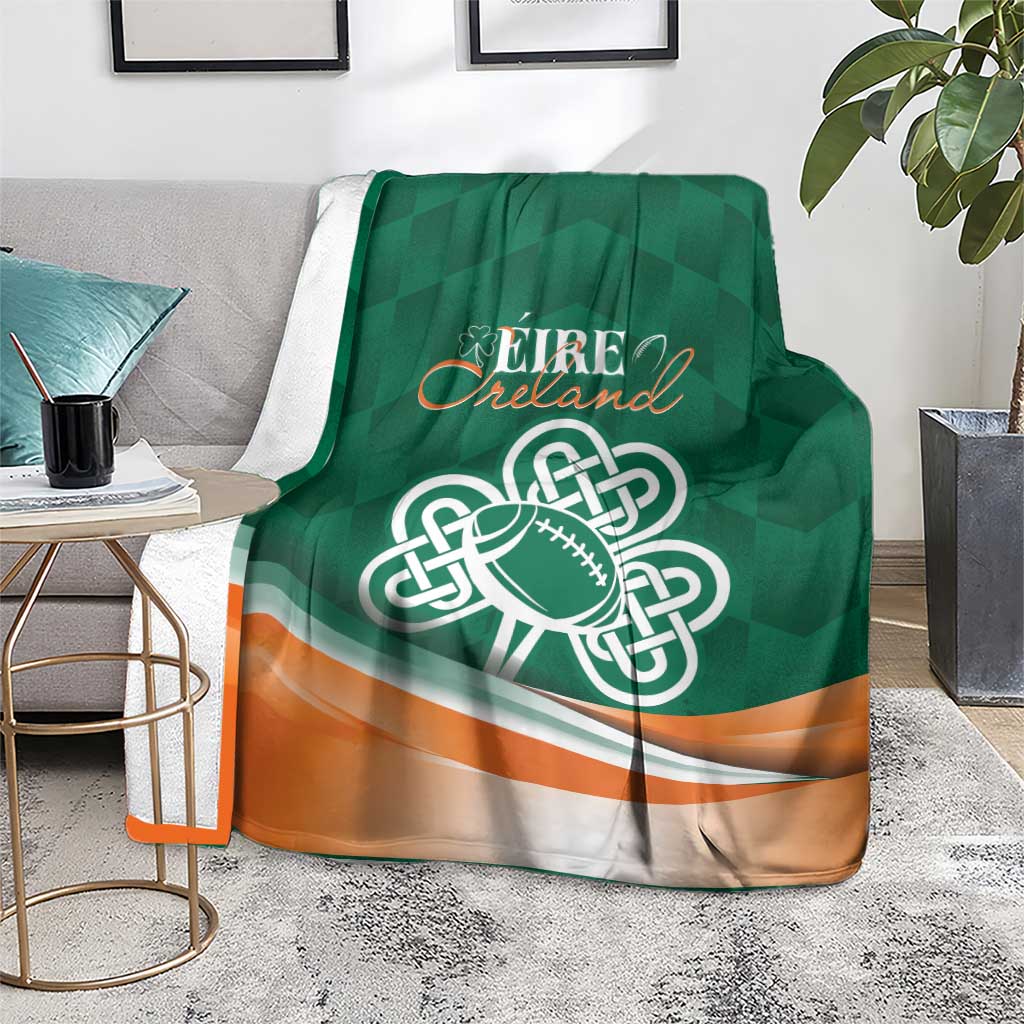Green Éire Ireland blanket with Celtic knot rugby ball design and orange trim