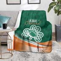 Green Éire Ireland blanket with Celtic knot rugby ball design and orange trim