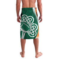 Green lavalava front with large white Celtic knot and rugby ball print