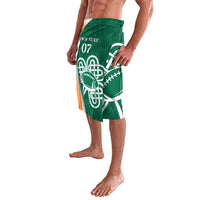 Green lavalava side view with white Celtic knot, rugby ball, and orange stripe