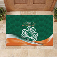 Green rubber doormat with Ireland text, celtic shamrock football logo, and orange wave trim