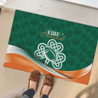 Green rubber doormat with Ireland text, celtic shamrock football logo, and orange wave design