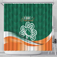 Green shower curtain featuring Ireland crest, shamrock football emblem, and orange wave hem