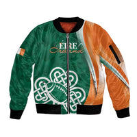 Green bomber jacket with orange sleeves, full-zip front, ribbed trim, shamrock knot graphic