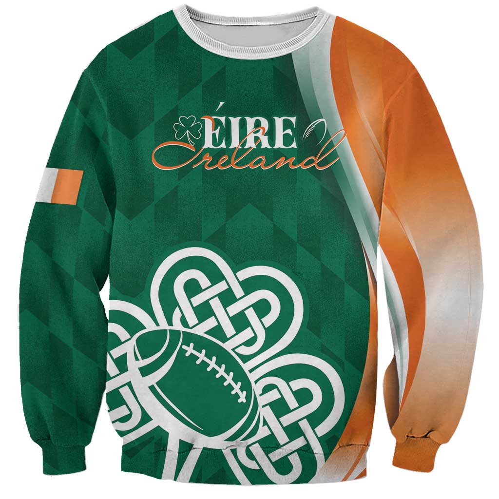 Green sweatshirt with white rib crew neck, orange contrast sleeves, shamrock football graphic